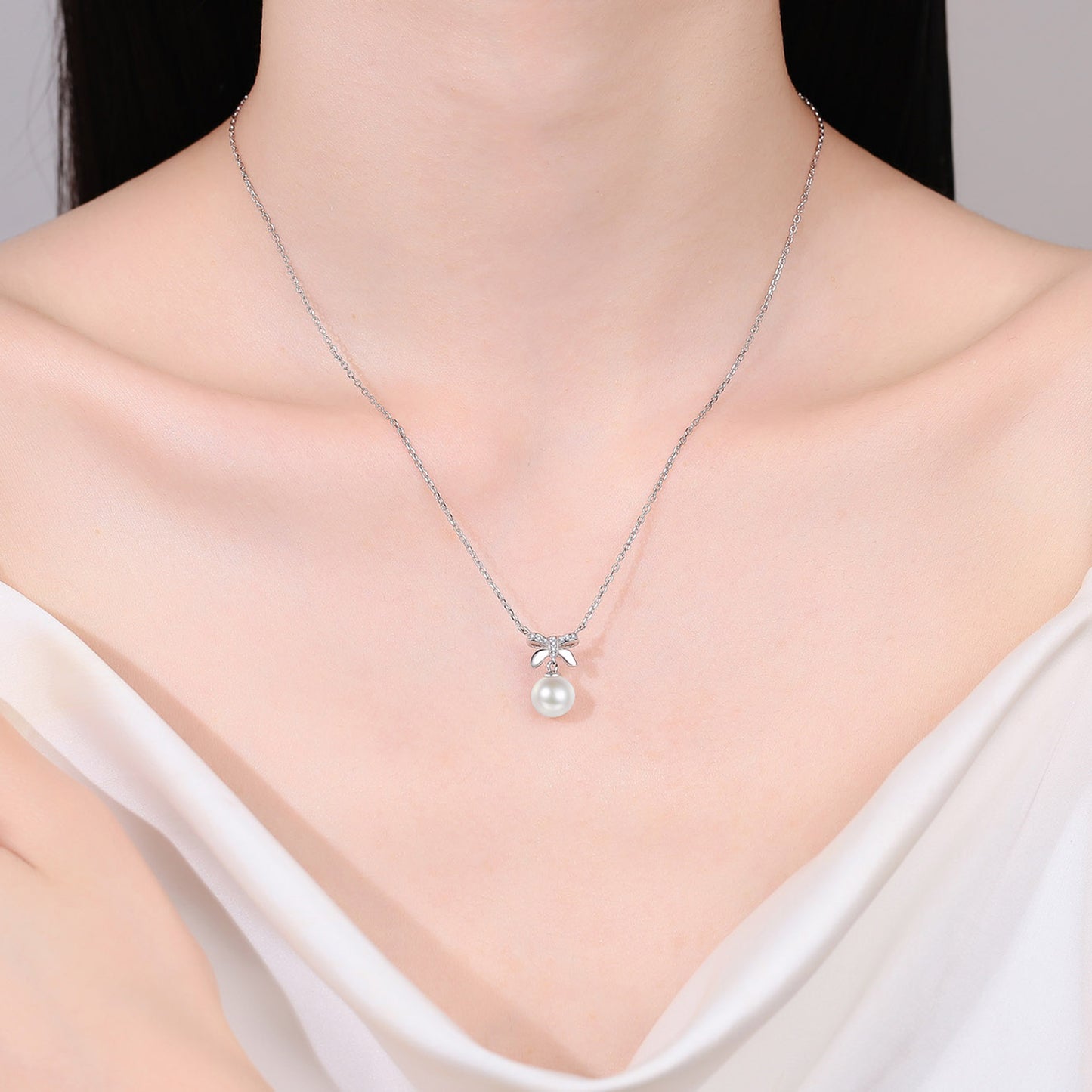 Lustrous Elegance Moissanite Bow Pearl Necklace